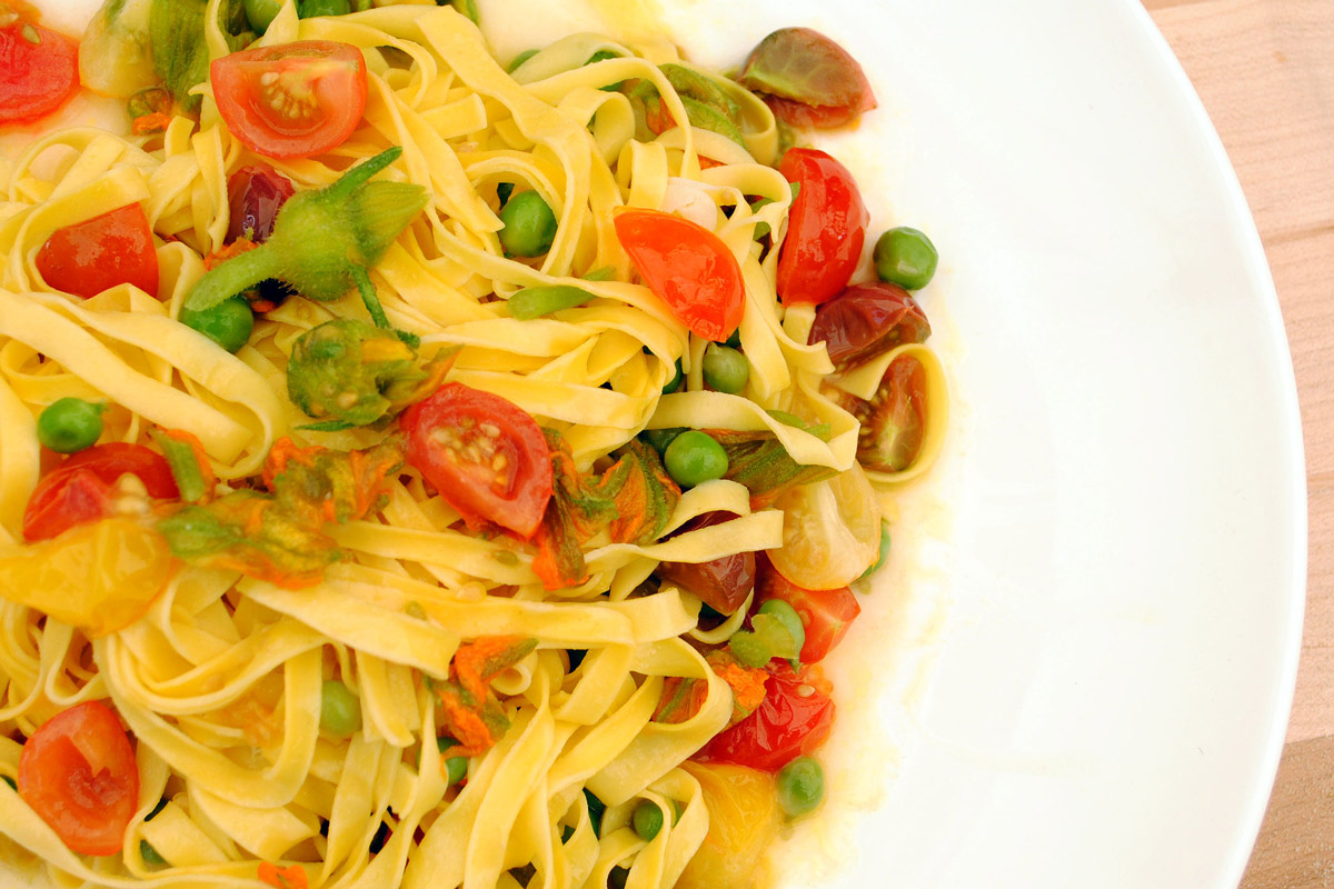 Tagliatelle with Squash Blossoms, Tomato, and English Peas Foodwise