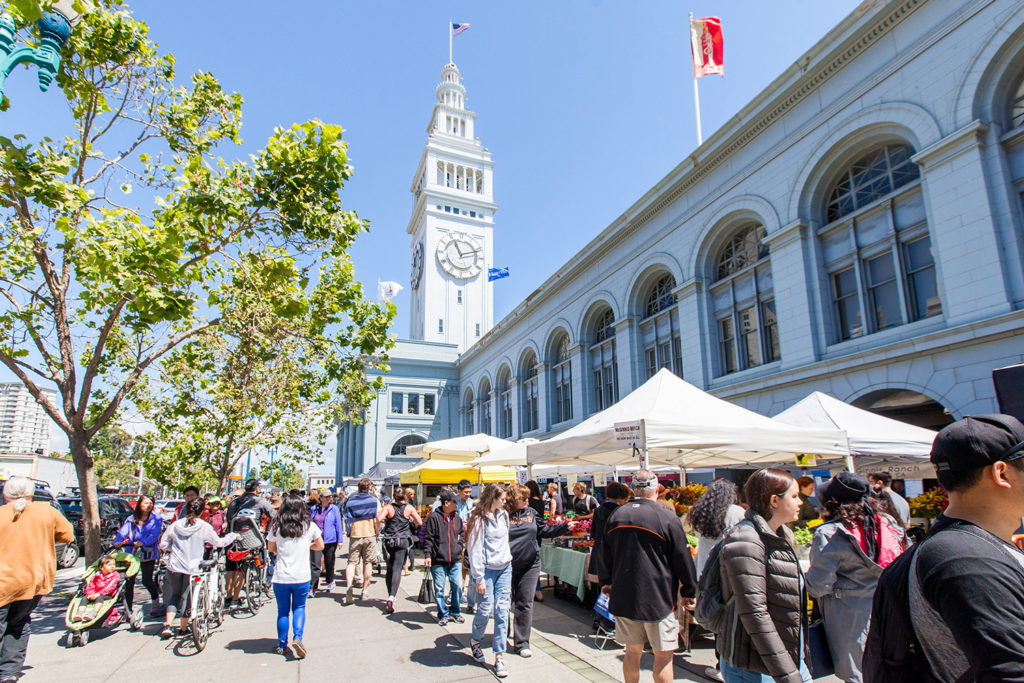 Ferry Plaza Farmers Market with Ferry Building in background