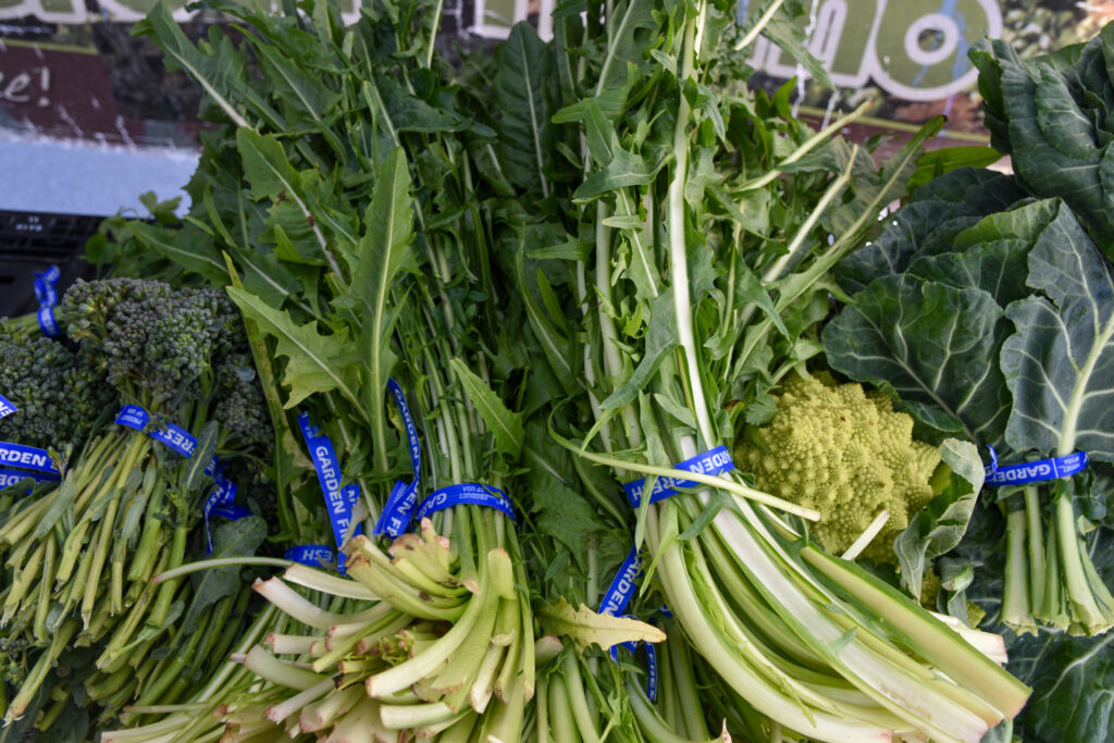 Bundles of dandelion greens at Green Thumb Farm's stand at Foodwise's Ferry Plaza Farmers Market in San Francisco.