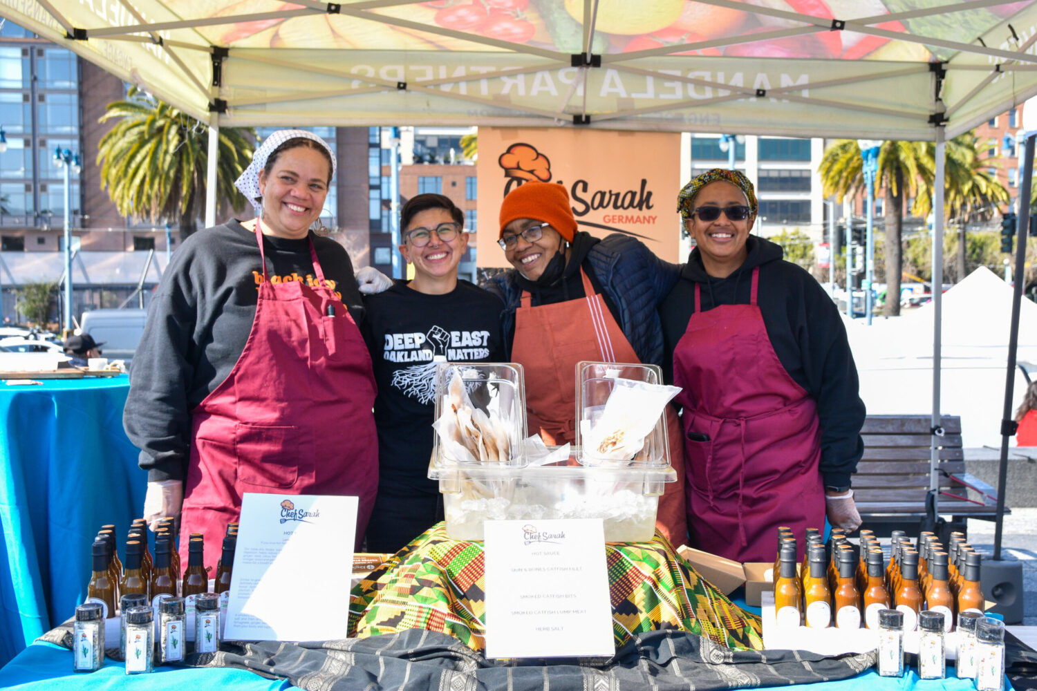 Chef Sarah Germany and her team at their booth at the farmers market